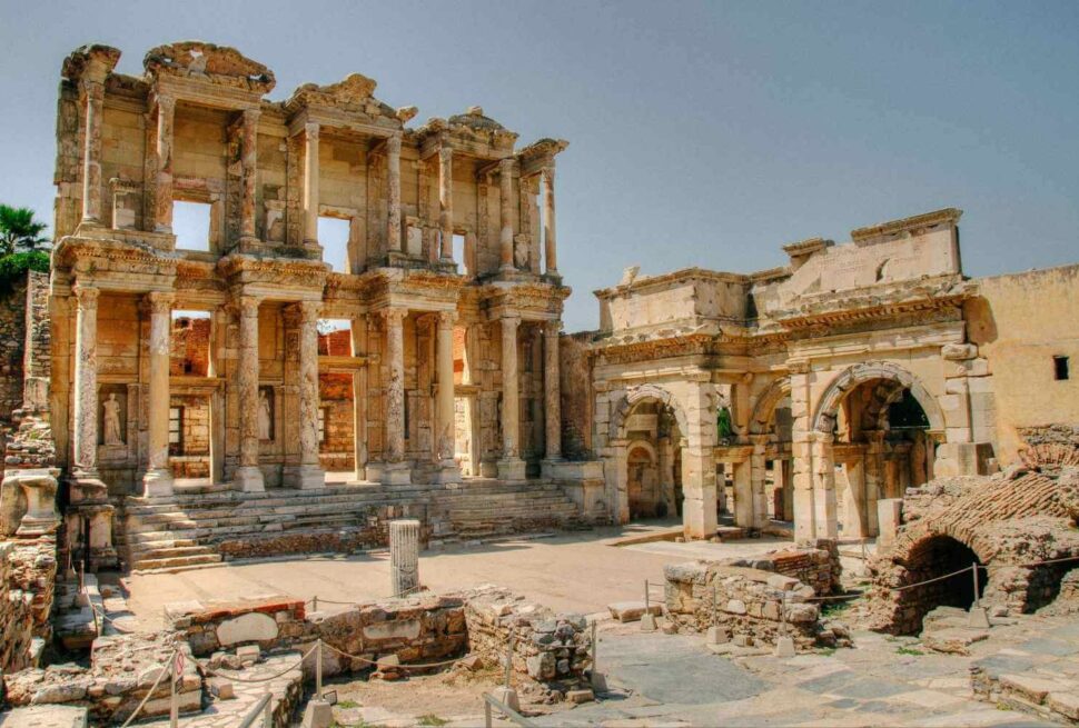 Ancient ruins of the Celsus Library in Ephesus, Turkey, showcasing grand columns and intricate stone carvings.