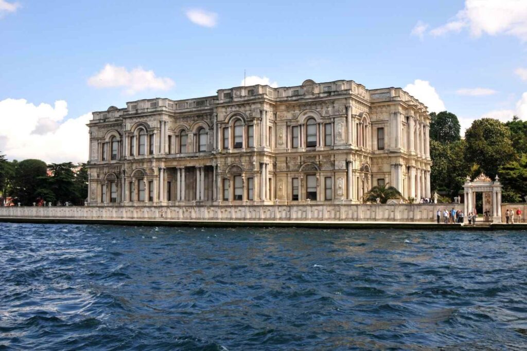 Beylerbeyi Palace with intricate architecture, located by the Bosphorus, featuring arched windows and detailed stonework.